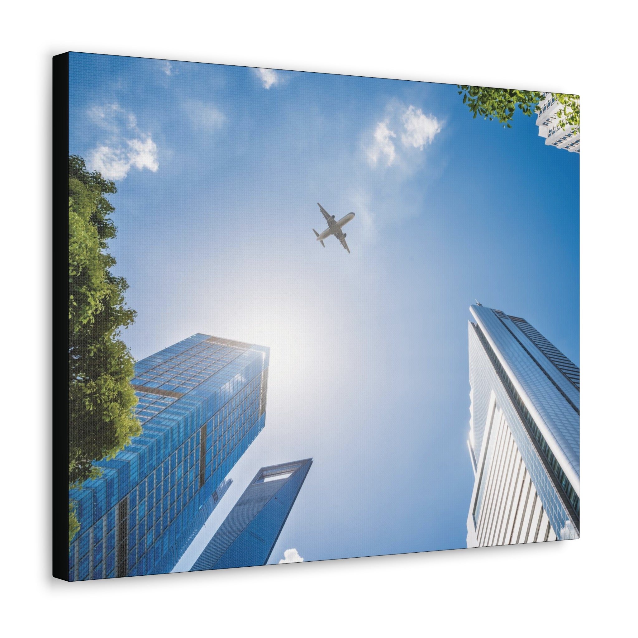 Airplane Flying Over Buildings Canvas Gallery Wrap